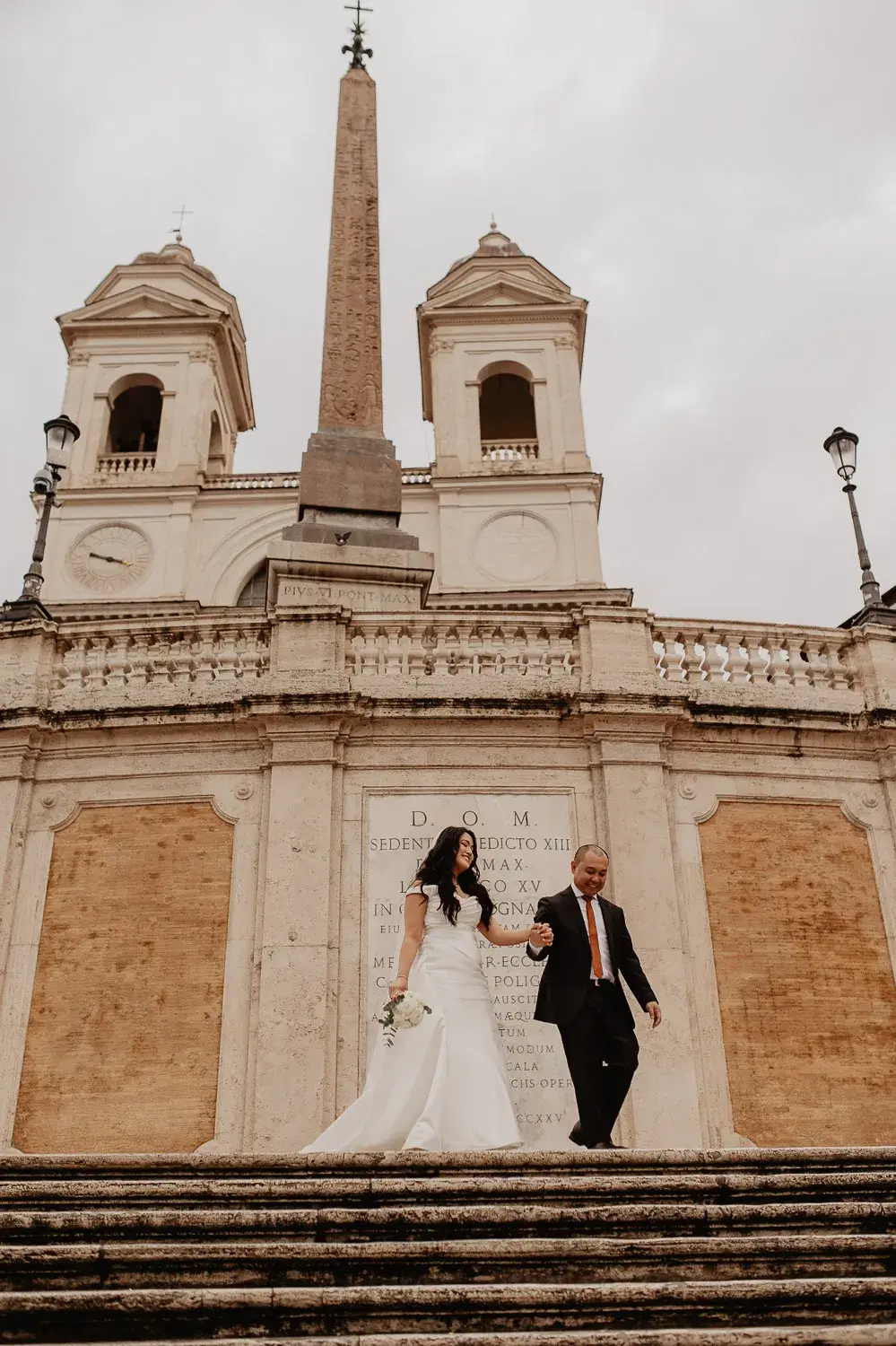 Couple celebrating their Rome elopement at a historic landmark